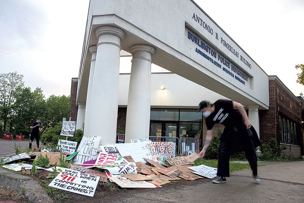 Protesters leaving signs outside the Burlington Police Department after a May 30 rally - JAMES BUCK