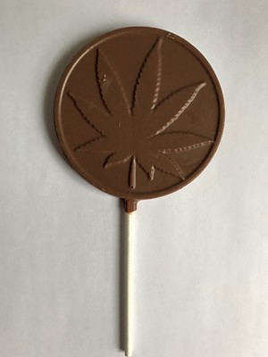 A CBD lollipop from Laughing Moon Chocolates - SALLY POLLAK ©️ SEVEN DAYS