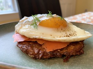 A latke served for brunch with smoked salmon, fried egg and dilled yogurt sauce. - MELISSA PASANEN ©️ SEVEN DAYS