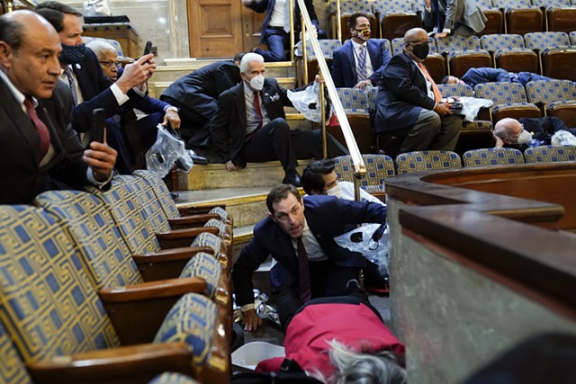 Rep. Peter Welch (far right) and others duck for cover in the U.S. House gallery - ASSOCIATED PRESS