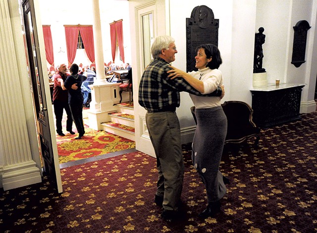 Rep. Mitzi Johnson and Rep. John Bartholomew waltzing during a concert in January - JEB WALLACE-BRODEUR