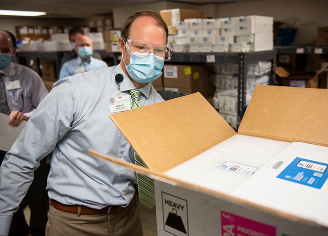 Wesley McMillian, director of pharmacy at UVM Medical Center, with a shipment of vaccine - COURTESY OF THE UNIVERSITY OF VERMONT MEDICAL CENTER