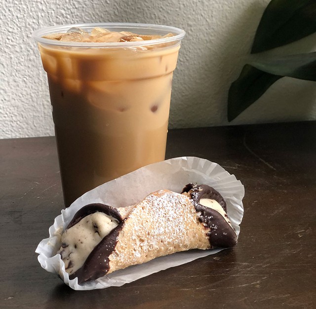 An iced maple latte and a cannoli from Black Cap Coffee - JORDAN BARRY ©️ SEVEN DAYS