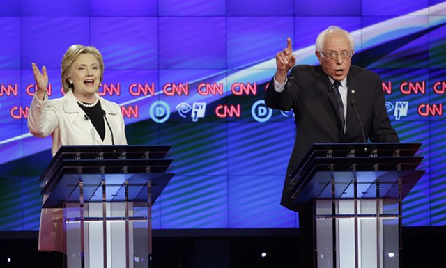 Hillary Clinton and Bernie Sanders debating Thursday night in Brooklyn. - AP PHOTO/SETH WENIG