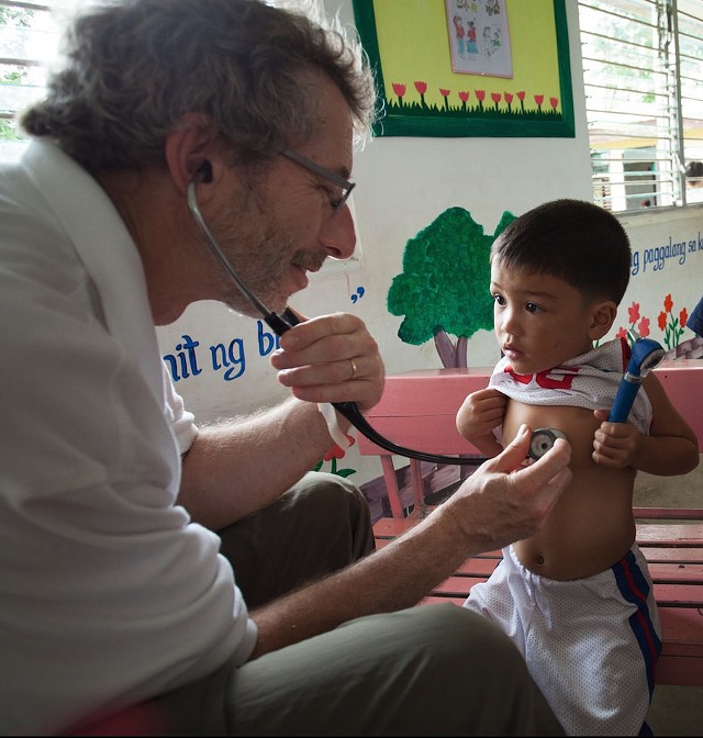Dr. Barry Finette evaluating a young patient in the Philippines. - FILE PHOTO COURTESY OF DR. BARRY FINETTE