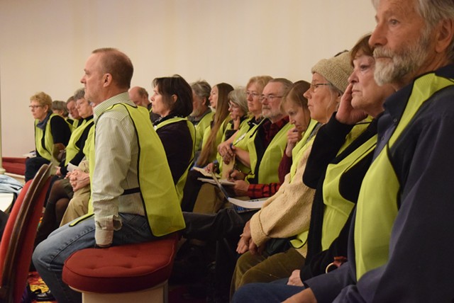Opponents of wind projects line the House chamber Tuesday wearing neon green vests. - TERRI HALLENBECK