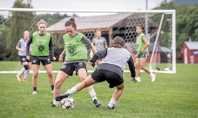 VT Fusion women’s soccer teammate Ilana Albert (center in green) fighting for the ball during a recent match - LUKE AWTRY