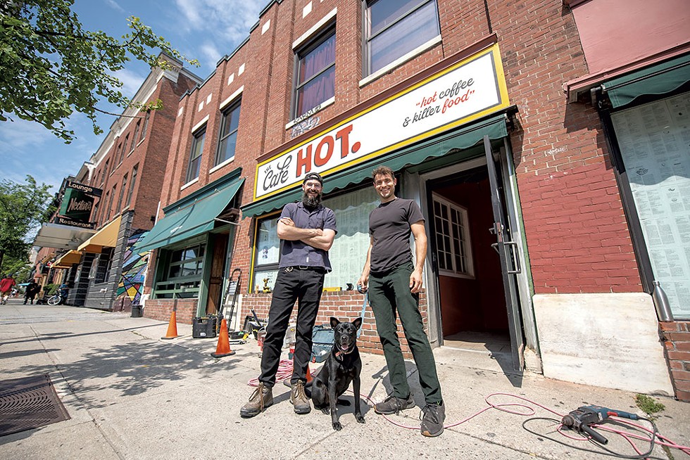 Travis (left) and Allan Walker-Hodkin with BMO the dog outside the Caf&eacute; HOT. - DARIA BISHOP