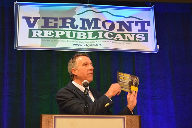 Lt. Gov. Phil Scott holds a flier that rival Republican gubernatorial candidate Bruce Lisman sent out. - TERRI HALLENBECK