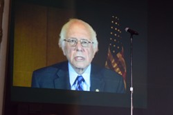 Sen. Bernie Sanders (I-Vt.) appears via video at Sunday's convention. - TERRI HALLENBECK