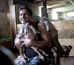 Rohit Adhikari with baby goats - JAMES BUCK