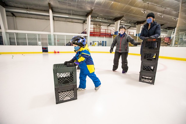 Skate instructor Julie MacDonald working with 4-year-old Liam Graziano and his mom, Jackie, from Williston. - CAT CUTILLO