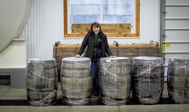 Cecile Branon with barrels of aging maple vinegar - GLENN RUSSELL