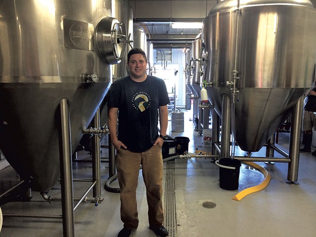 Christian Weber in the tank room at Common Roots Brewing Company - JULIA CLANCY