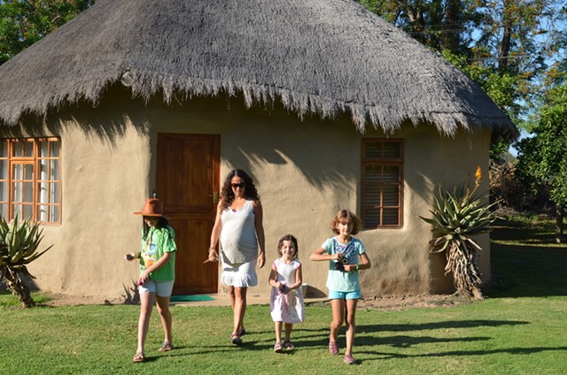 Staying in a rondavel, a traditional Xhosa thatched-roof round hut made from mud.