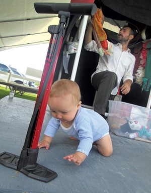 Charlie explores while his dad sets up for a performance - LANDER/FRIEDMAN