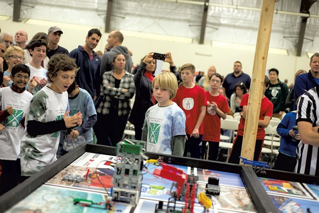Members of the Green - Mountain Gears watching as - the irrobot navigates the gameboard - at the FIRST LEGO League State - Championships last November - COURTESY OF MARK COLLIER