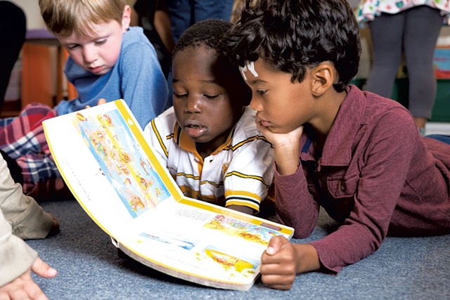 Kindergarten students at IAA reading together - SAM SIMON
