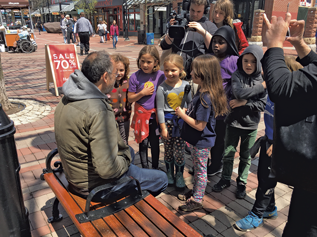 Newspaper staffers from George Leal's second grade class at the Integrated Arts Academy interviewing bystanders on Church Street after a flash mob featuring fellow students - COURTESY OF BURLINGTON SCHOOL DISTRICT