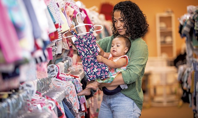 Maria Munroe and her 9-month-old daughter, Malia, shopping at Boho Baby - CAT CUTILLO