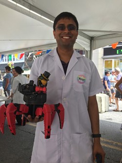 Nirav Shah, of Burlington’s Laboratory B, with Fluffy the laser-shooting robot