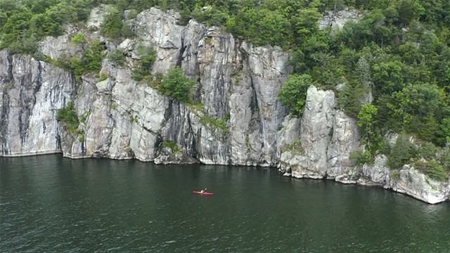 Paddling along "the Palisades" of Split Rock Forest, N.Y., in a scene from "No Other Lake" - COURTESY
