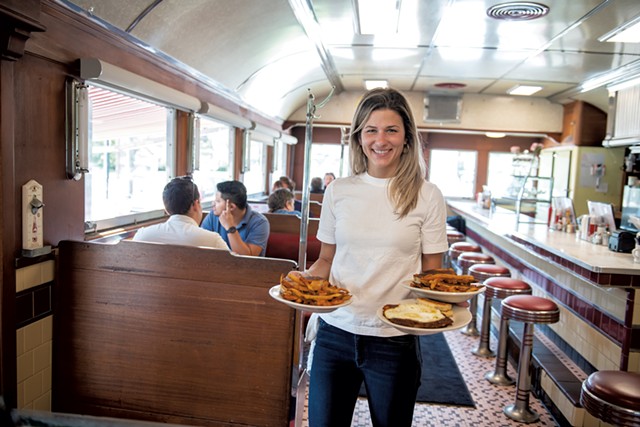 Natalie Sheils delivering food at the Parkway Diner - DARIA BISHOP