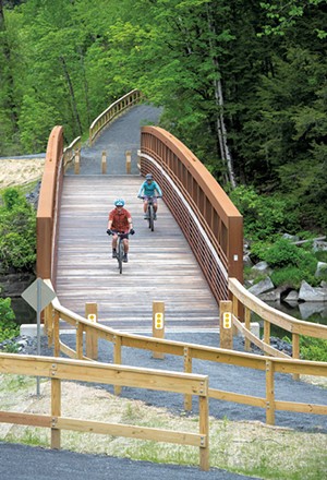 Cyclists on the Cross Vermont Trail bridge in Montpelier - JEB WALLACE-BRODEUR