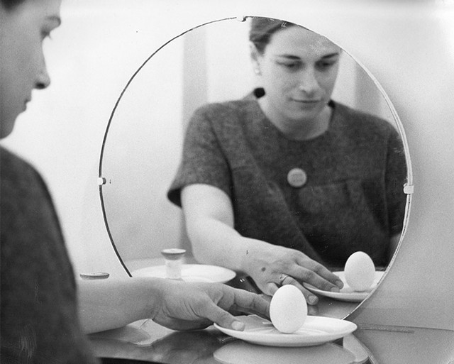 Bici Forbes (aka Nye Ffarrabas) balancing an egg (1967) - PHOTOGRAPH BY PETER MOORE &copy;NORTHWESTERN UNIVERSITY