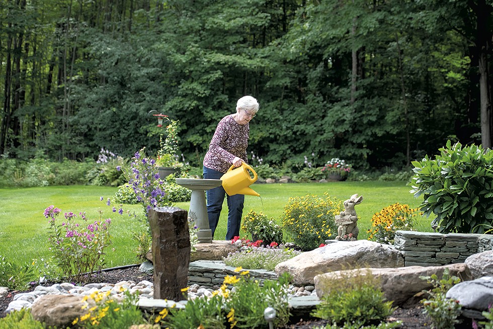 Cheryl Walker tending to her gardens - DARIA BISHOP