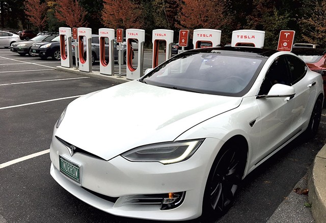 Tesla Supercharger station at Healthy Living Market & Café - DAN BOLLES