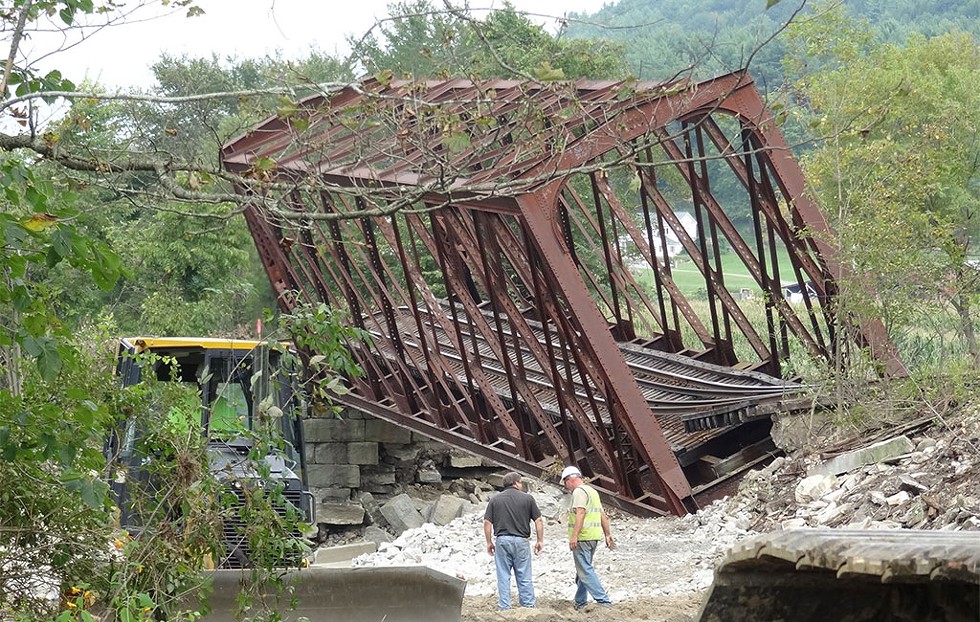 Damage from Tropical Storm Irene devastated the Vermont Rail System. The railroad found 107 track washouts, 11 miles of destroyed tracks and six rail bridges that suffered major structural damage. - COURTESY OF VERMONT RAIL SYSTEM