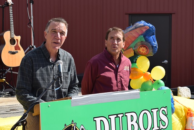 Republican gubernatorial candidate Phil Scott (left) announces he will sell his share in DuBois Construction if he’s elected governor, as co-owner  Don DuBois looks on Saturday outside the company's Middlesex offices. - TERRI HALLENBECK