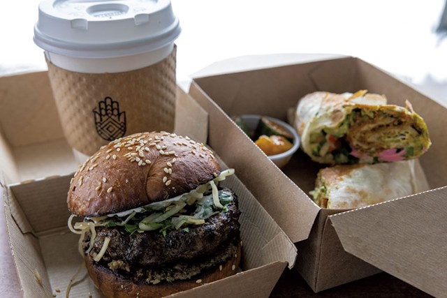 Takeout lunch of a lamb burger, chicken shawarma and coffee - JAMES BUCK