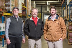 Black River Produce founders Steve Birge and Mark Curran with President Sean Buchanan - COURTESY OF OLIVER PARINI