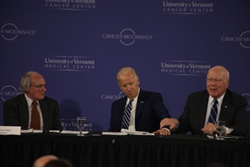 Sen. Patrick Leahy holds Vice President Joe Biden's arm Friday morning during a roundtable at the University of Vermont. - MATTHEW THORSEN