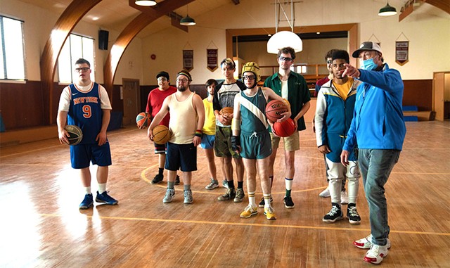 From left: Actors James Day Keith, Tom Sinclair, Kevin Iannucci, Matthew von der Ahe, Ashton Gunning, Casey Metcalfe, Bradley Edens, Alex Hintz, Joshua Felder and director Bobby Farrelly on the set of 'Champions.' - COURTESY OF FOCUS FEATURES
