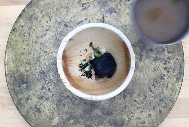 Legit stone soup: fish broth heated by a hot rock - DANA HEFFERN