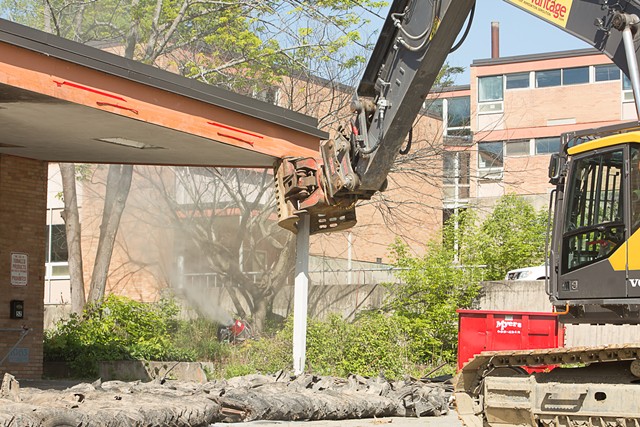 A claw excavator dismantles the high school's entryway - COURTESY OF BURLINGTON SCHOOL DISTRICT