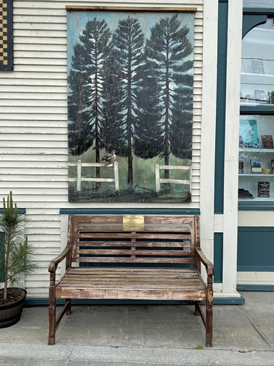 Three Pines mural and bench, dedicated to Michael Whitehead, outside Brome Lake Books - DAVE SIMPSON