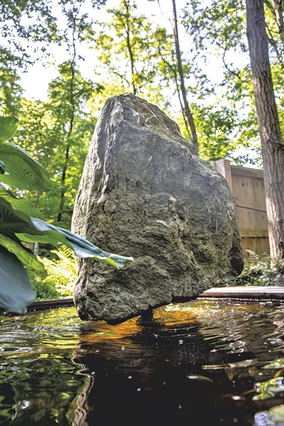 A boulder sculpture in a fountain at the garden - JAMES BUCK
