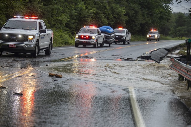 Crews along flooded Route 103 in Chester - JAMES BUCK