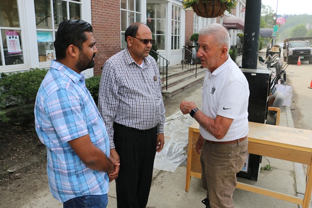 Fred Bashara (right) talking cleanup efforts with Dilip Patel (center). - KEVIN MCCALLUM ©️ SEVEN DAYS