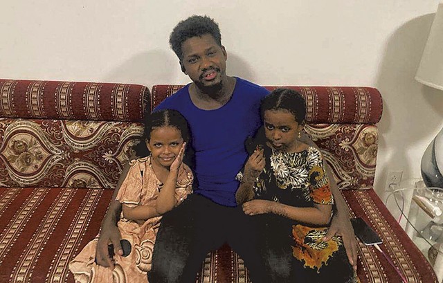 Omar with his daughters - COURTESY