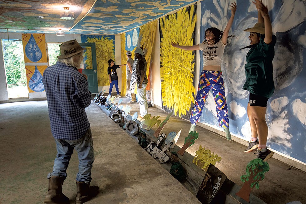 Peter Schumann and puppeteers in front of his bedsheet murals - LUKE AWTRY