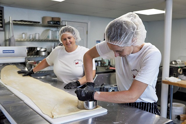 Jennifer McCabe-de Achaval (left) and Jacqueline de Achaval cutting empanada dough - COURTESY OF ERICA ALLEN PHOTOGRAPHY