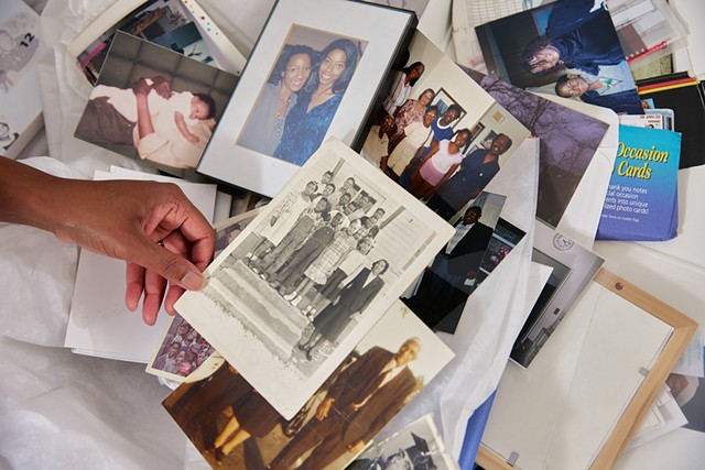 Lacretia Johnson Flash looks at family photos - COURTESY OF SASHA PEDRO