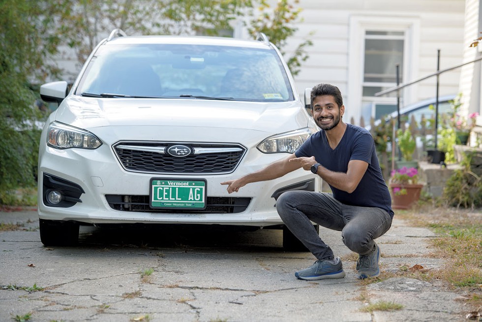 Irfan Tahir pointing out his Subaru's license plate - DARIA BISHOP