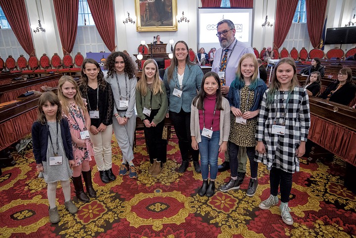 Mary Neffinger and students from the Bixby Memorial Free Library accepting an award from Vermont Humanities executive director Christopher Kaufman Ilstrup - JEB WALLACE-BRODEUR