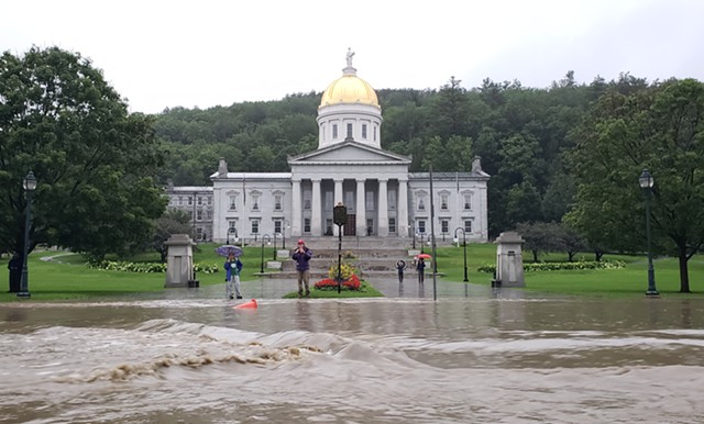 Floodwaters flowing past the Vermont Statehouse - FILE: KEVIN MCCALLUM ©️ SEVEN DAYS
